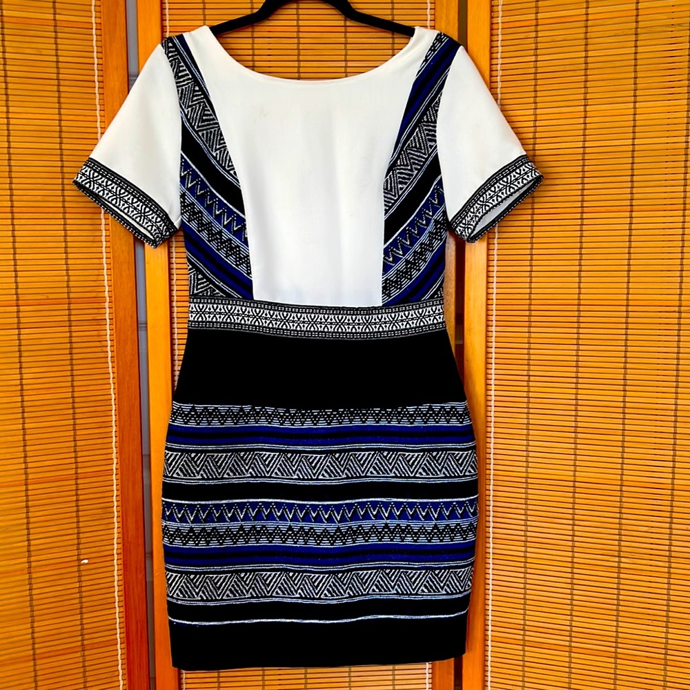 Unique piece. Fitted dress. White top | woven black & blue skirt. Sexy low back.